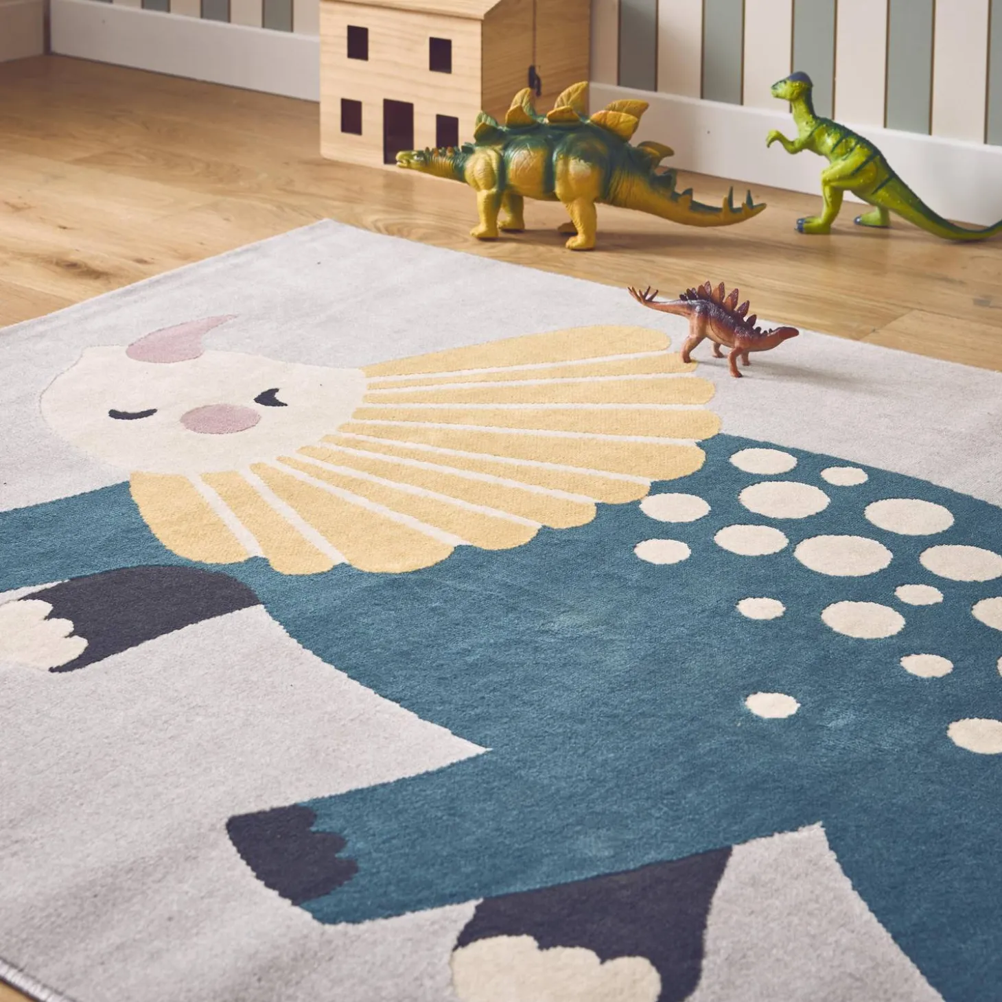 Children's light grey interior rug with dinosaur print