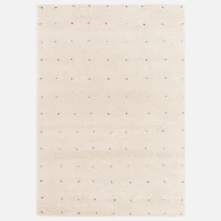 Children's rug with small colourful polka dots