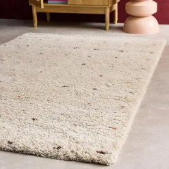 Children's rug with small colourful polka dots