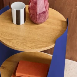 Curved metal side table or bedside table with wood decor and casters