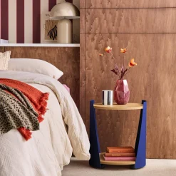 Curved metal side table or bedside table with wood decor and casters