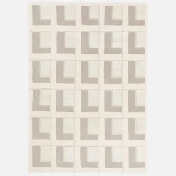 Indoor rug with geometric patterns in cream