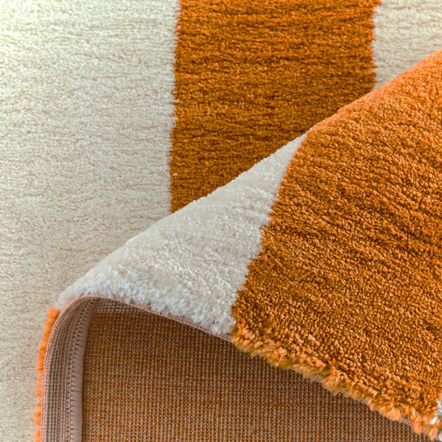 Indoor rug with ochre and white stripes