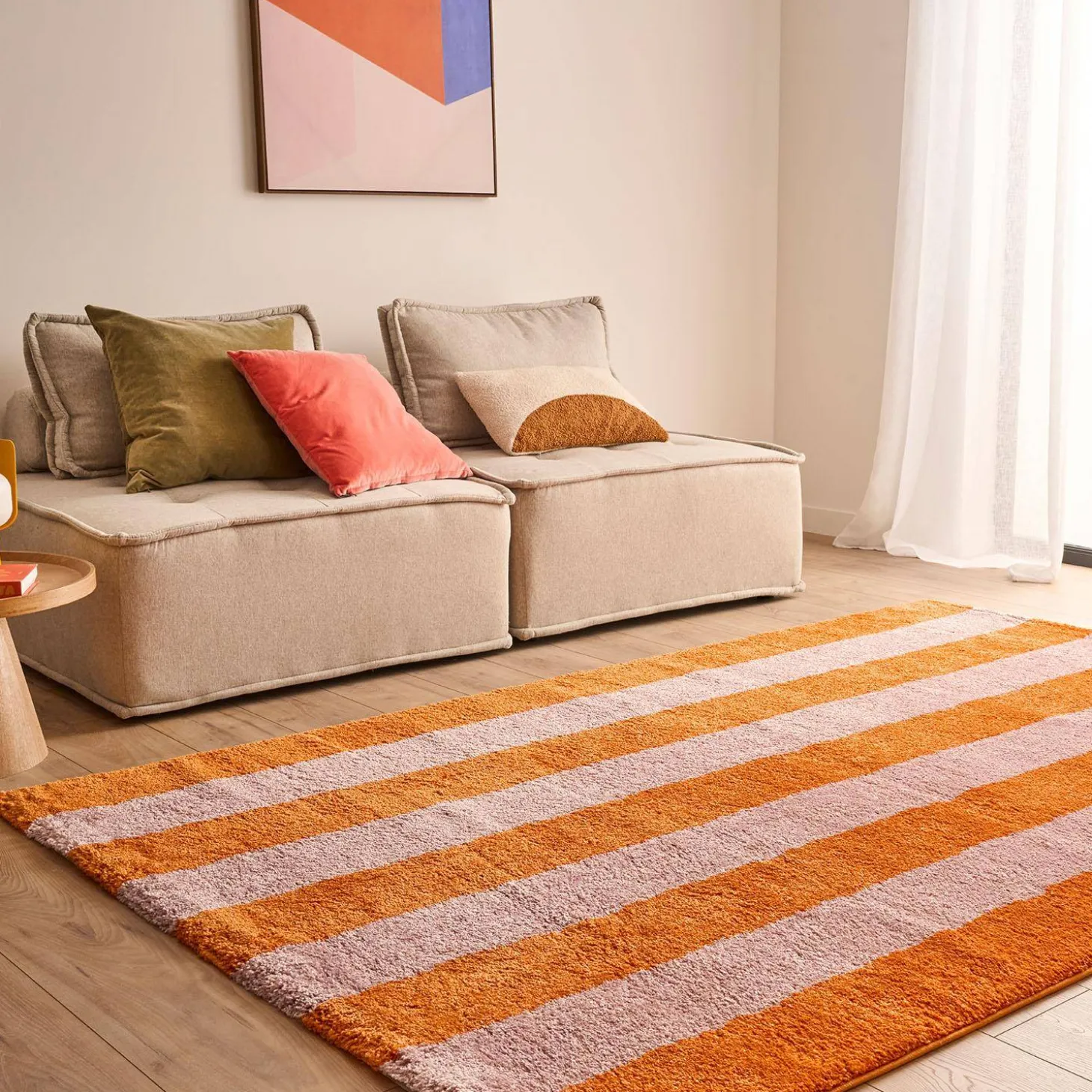 Indoor rug with orange and pink stripes