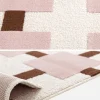 Indoor rug with pink and brown checkered pattern