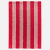 Indoor rug with red and pink stripes
