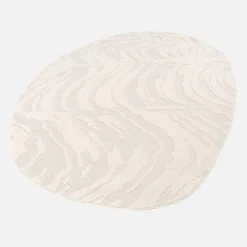 Interior pebble-shaped rug in relief cream