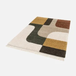 Interior rug shaggy with multicoloured geometric pattern and fringes