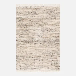 Interior rug with mottled pattern, cream