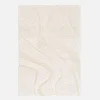 Interior shaggy rug with embossed cream motif