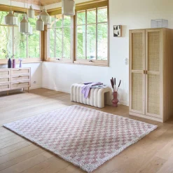 Old pink and cream checkerboard interior rug