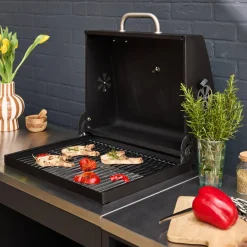 Outdoor kitchen with charcoal barbecue and 3 modules with sink