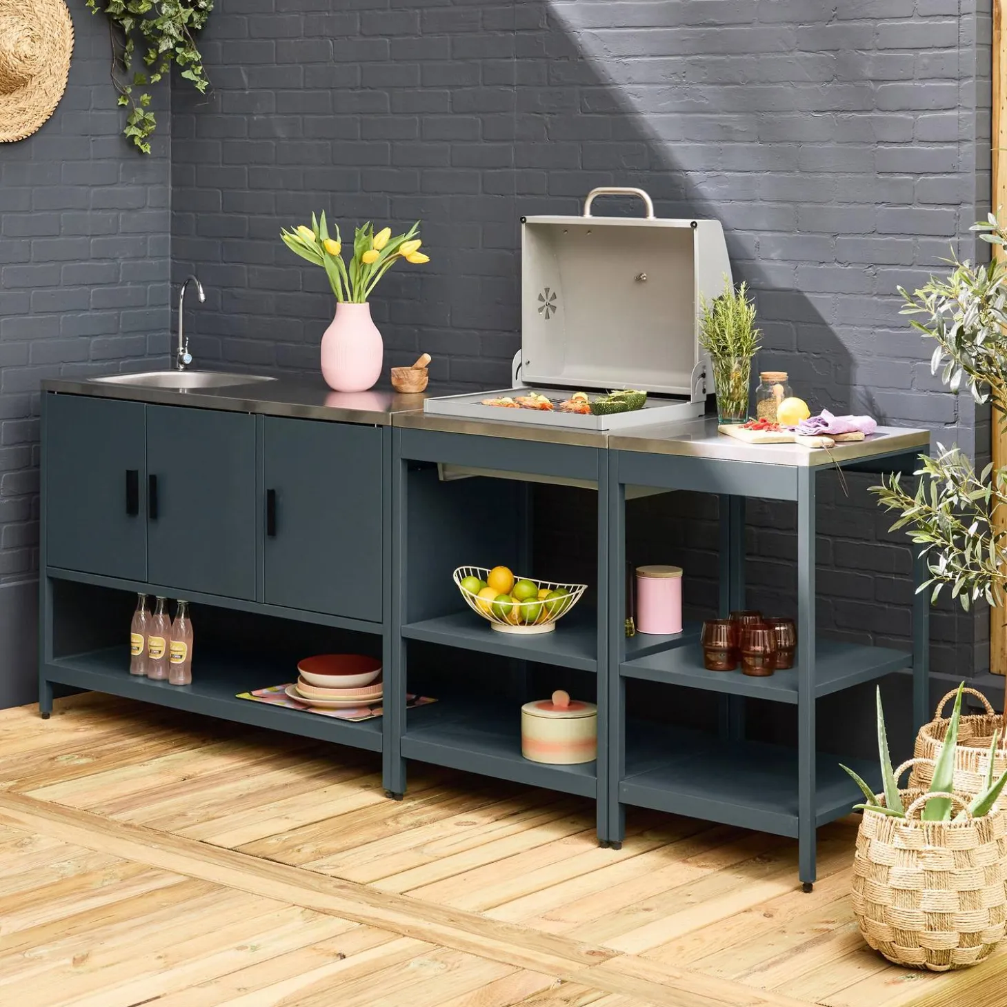 Outdoor kitchen with charcoal barbecue and 3 modules with sink