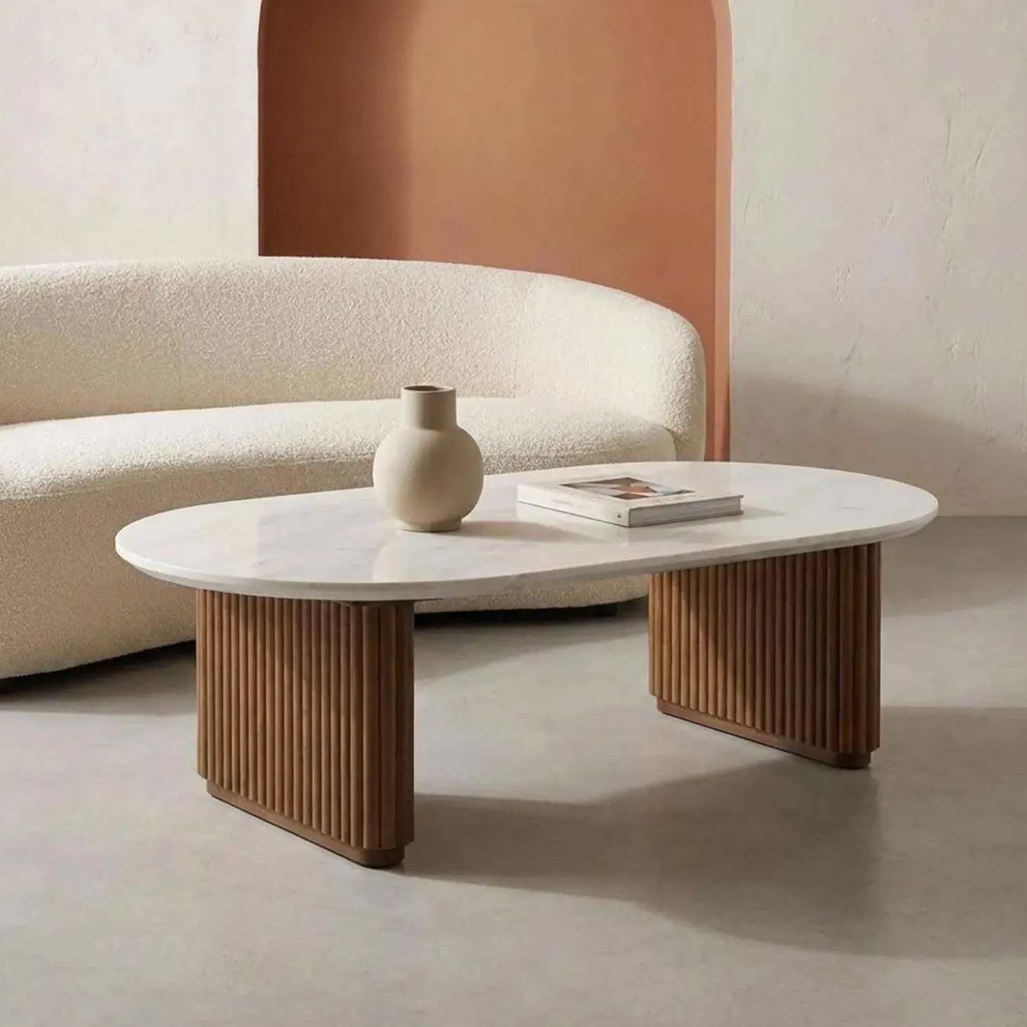 Oval coffee table in rubberwood with stone effect veneer