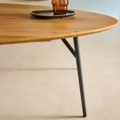 Oval coffee table with black metal legs and oak effect