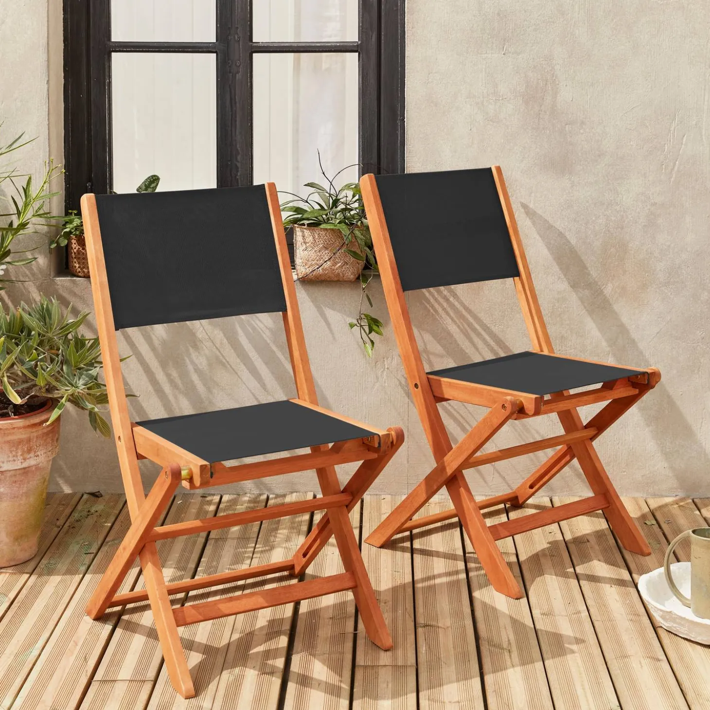 Pair of foldable wooden garden chairs