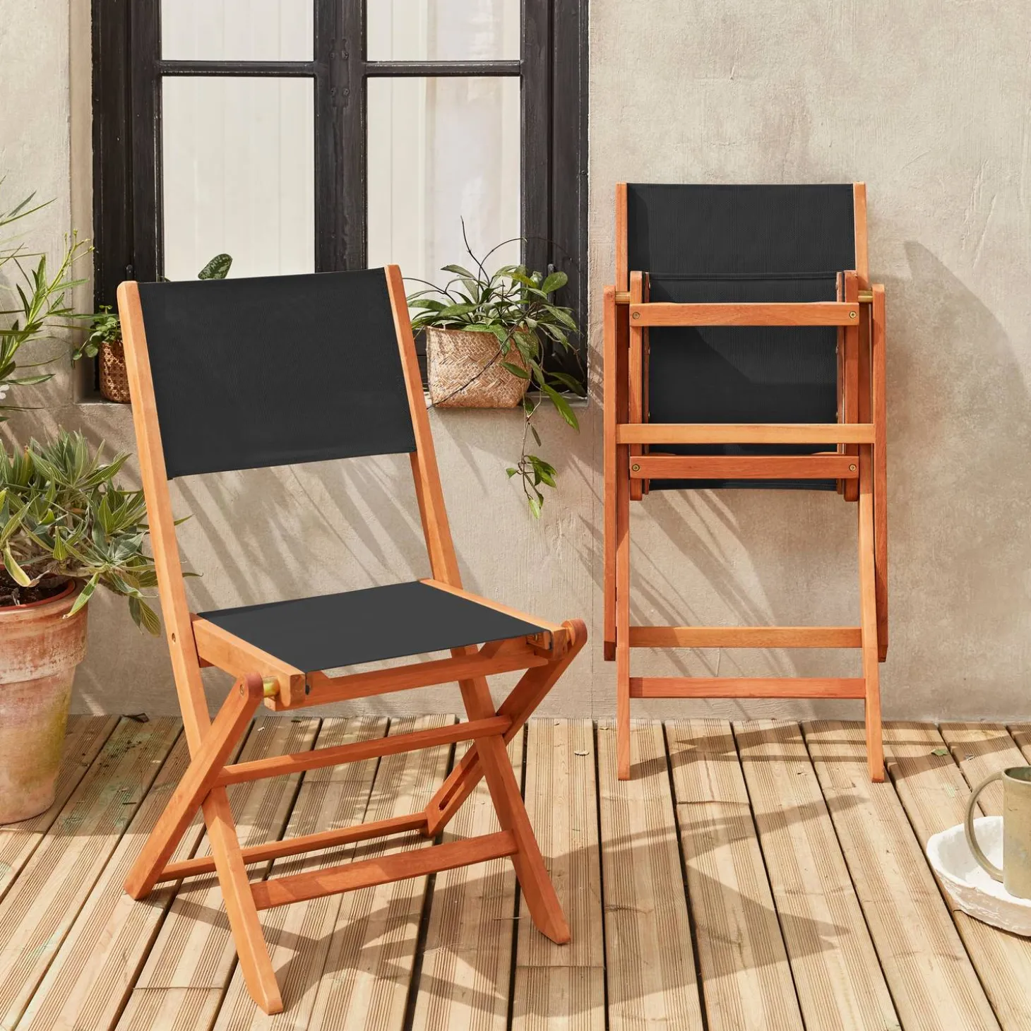 Pair of foldable wooden garden chairs