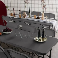 Pair of folding plastic reception tables with 12 chairs
