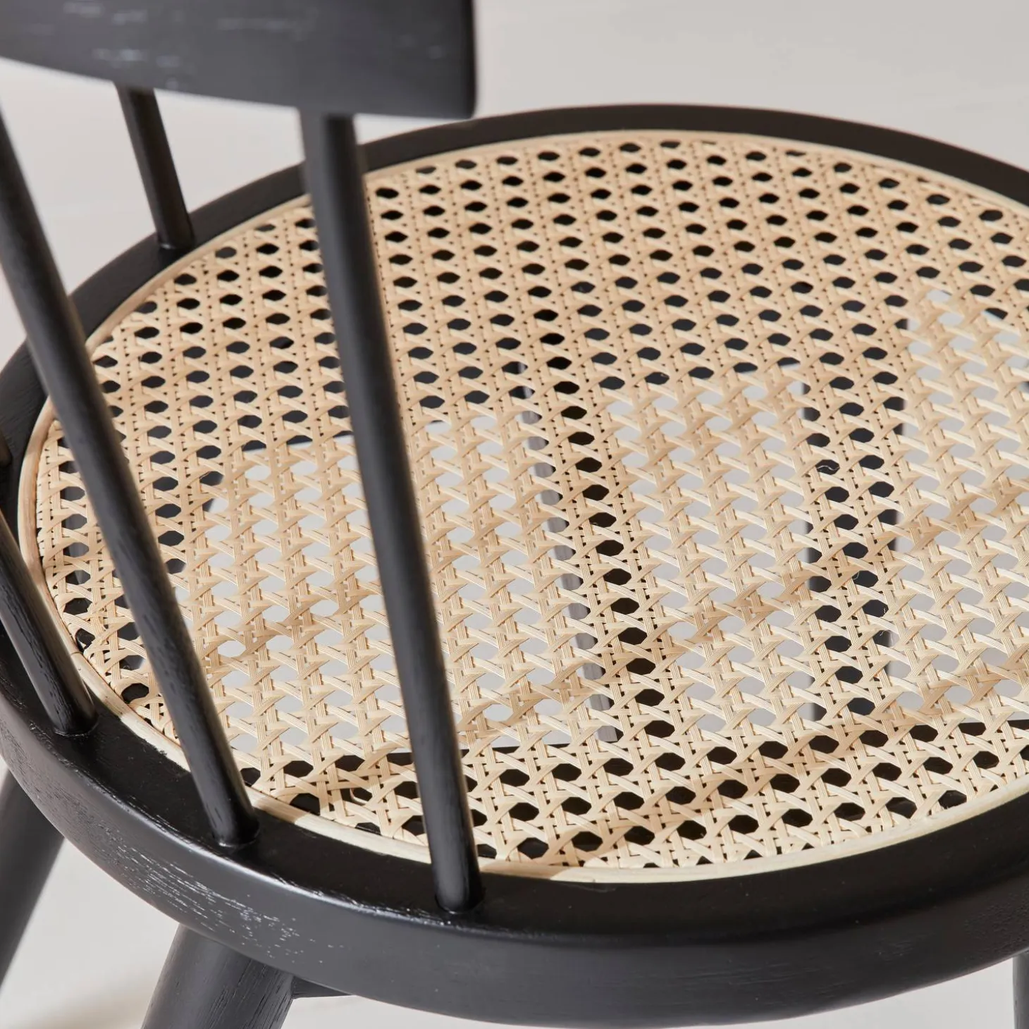 Pair of wood and cane dining chairs