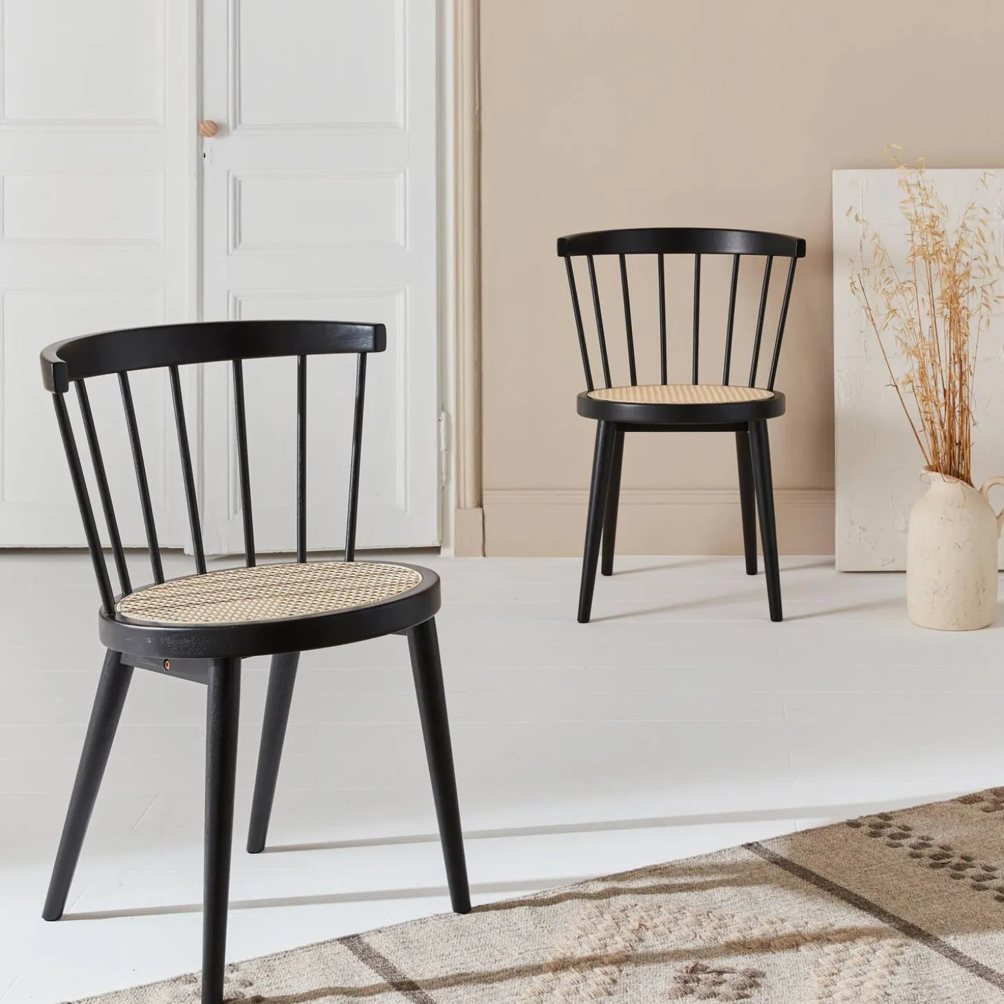 Pair of wood and cane dining chairs