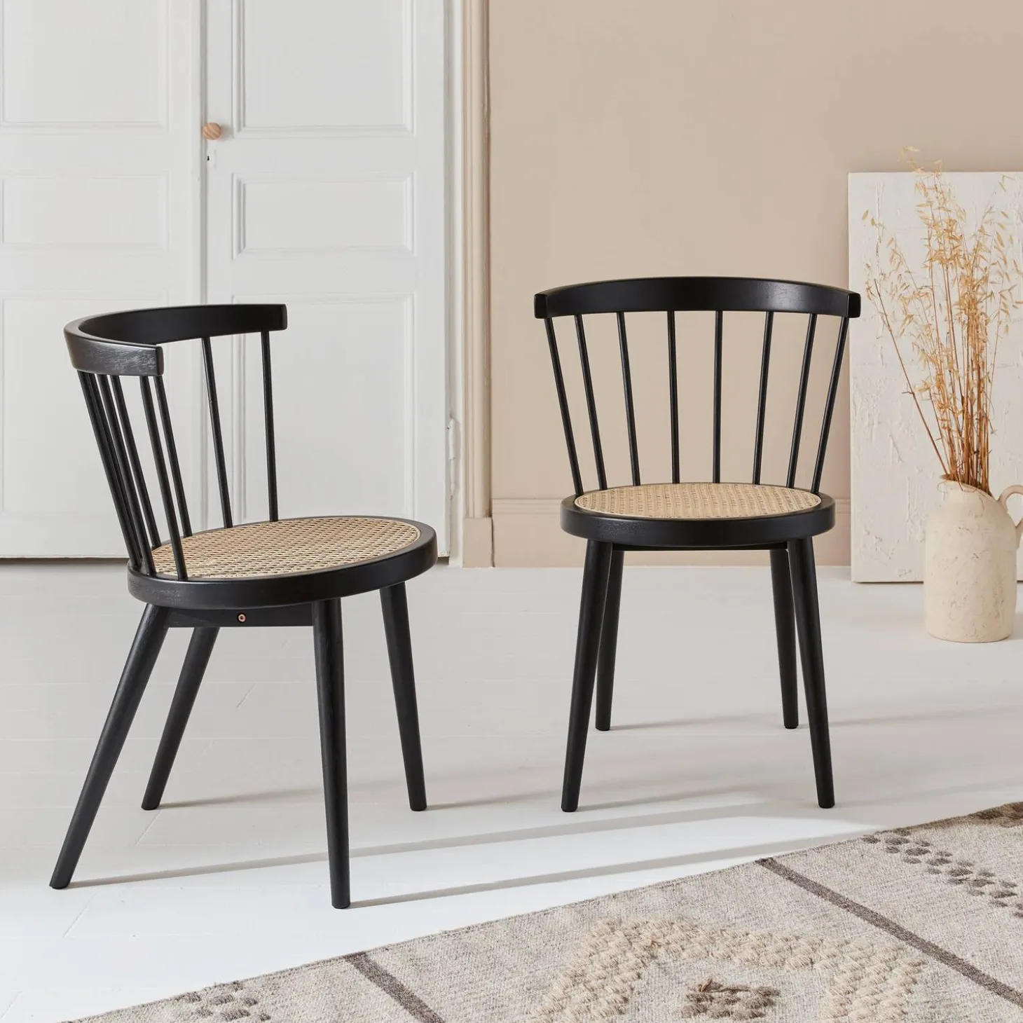 Pair of wood and cane dining chairs