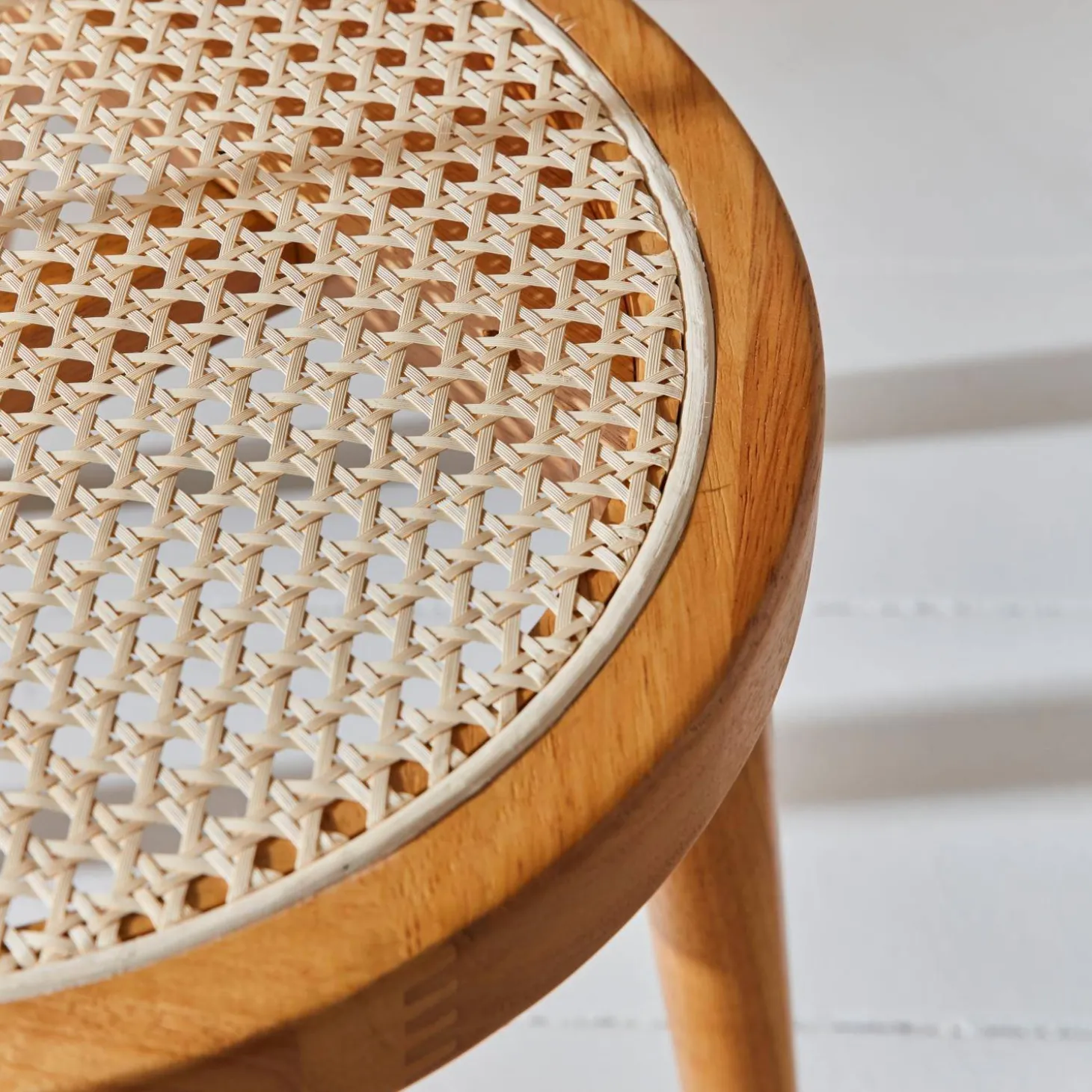 Pair of wood and cane dining chairs