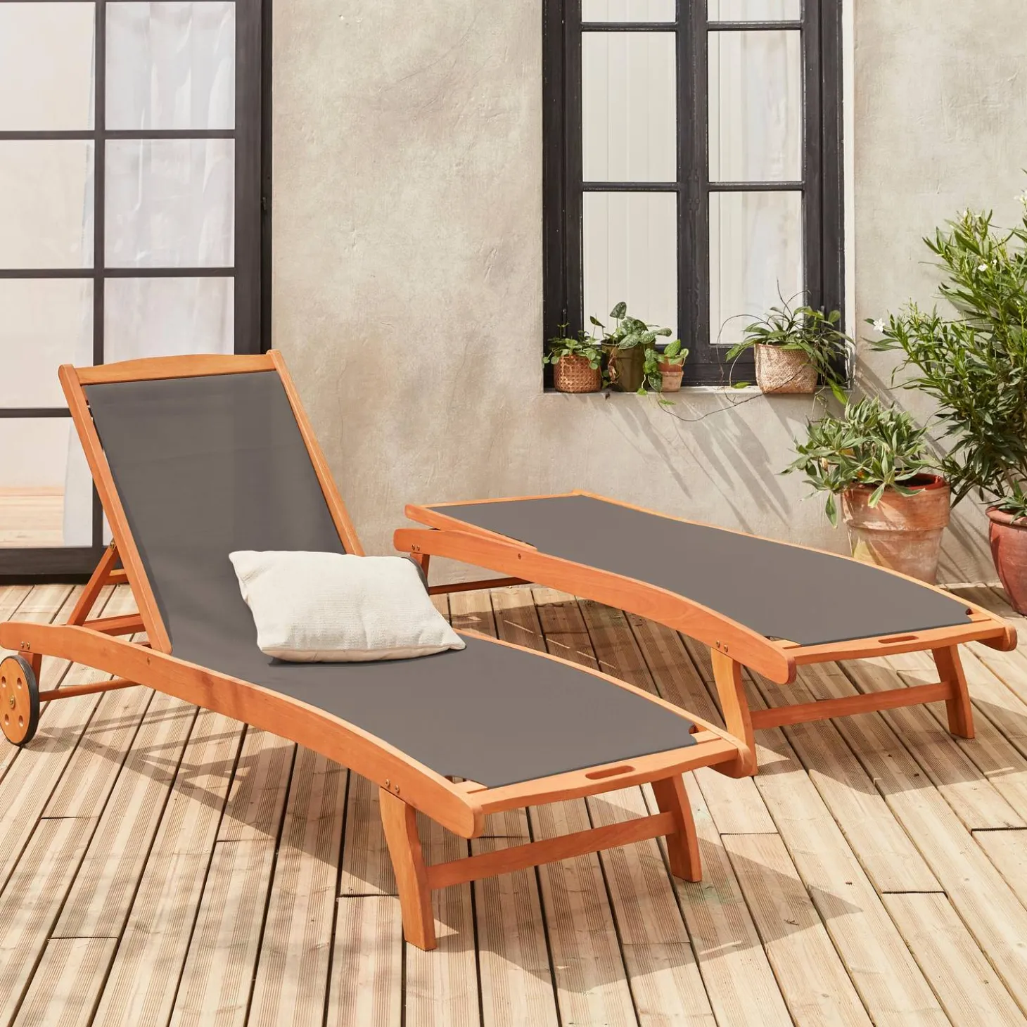 Pair of wooden and textilene sun loungers