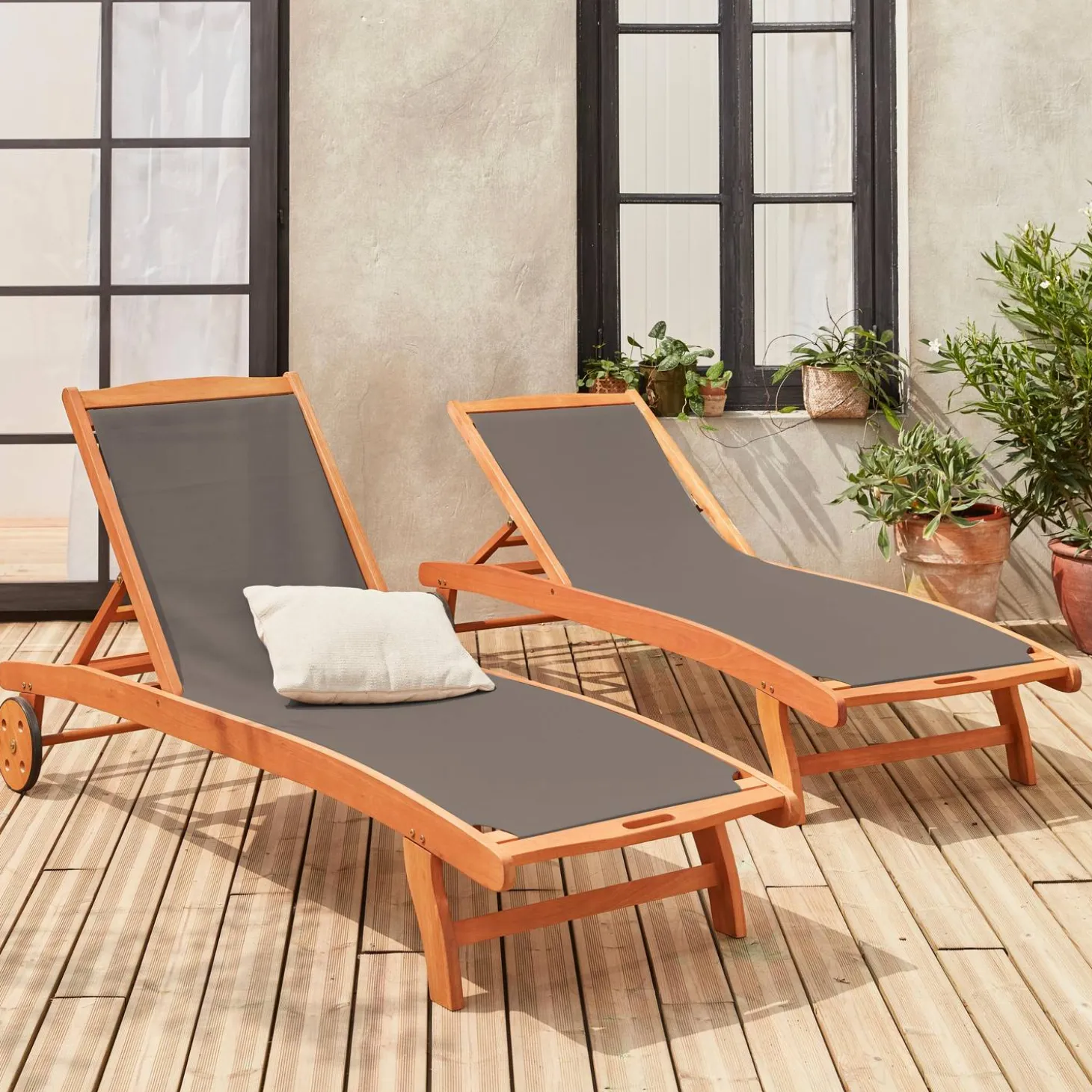 Pair of wooden and textilene sun loungers