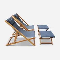 Pair of wooden deckchairs and footrests