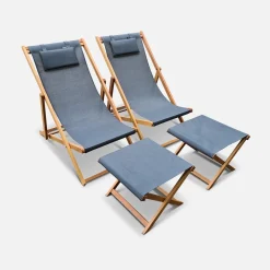 Pair of wooden deckchairs and footrests