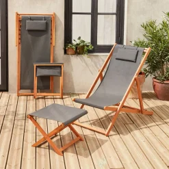 Pair of wooden deckchairs and footrests