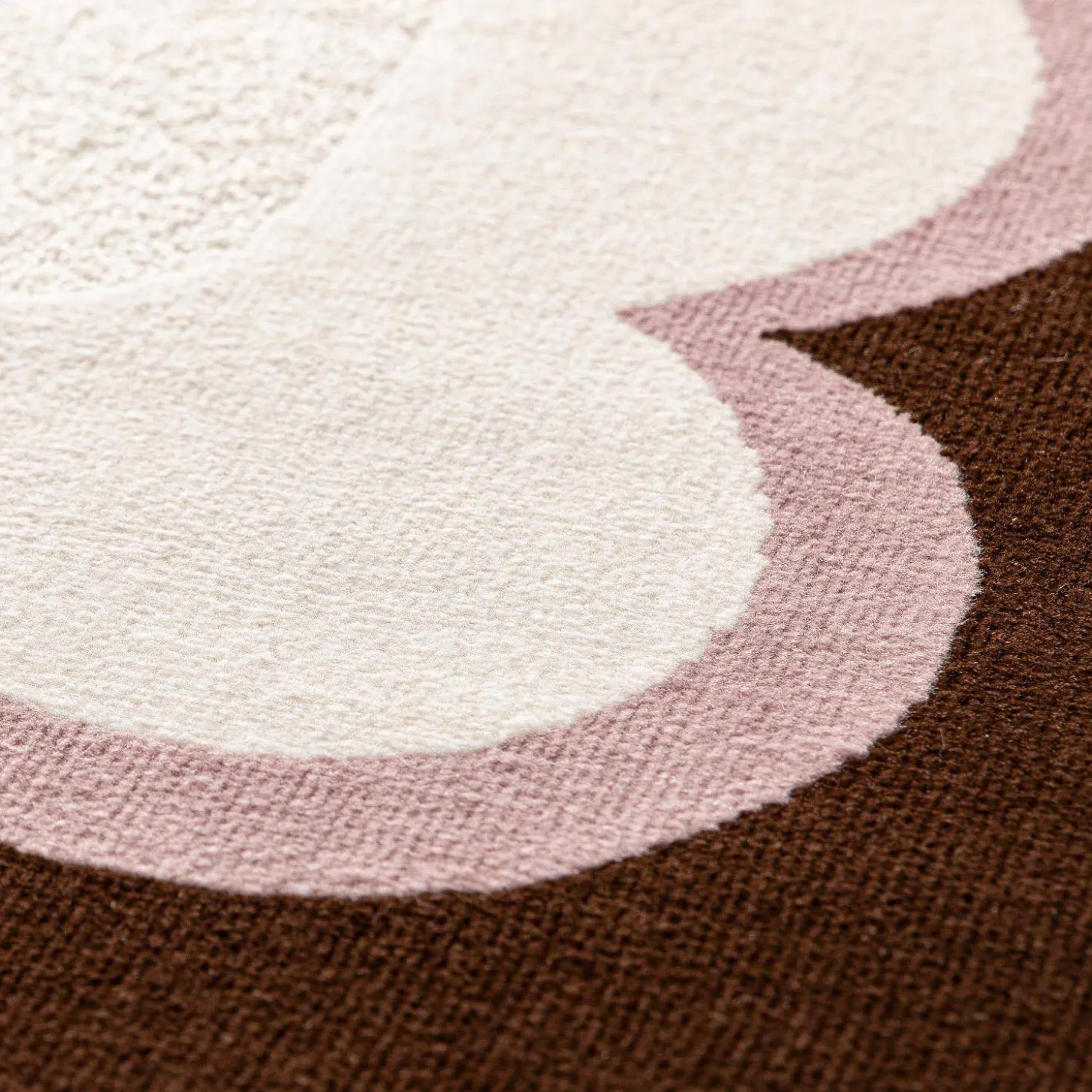 Pink and brown indoor rug
