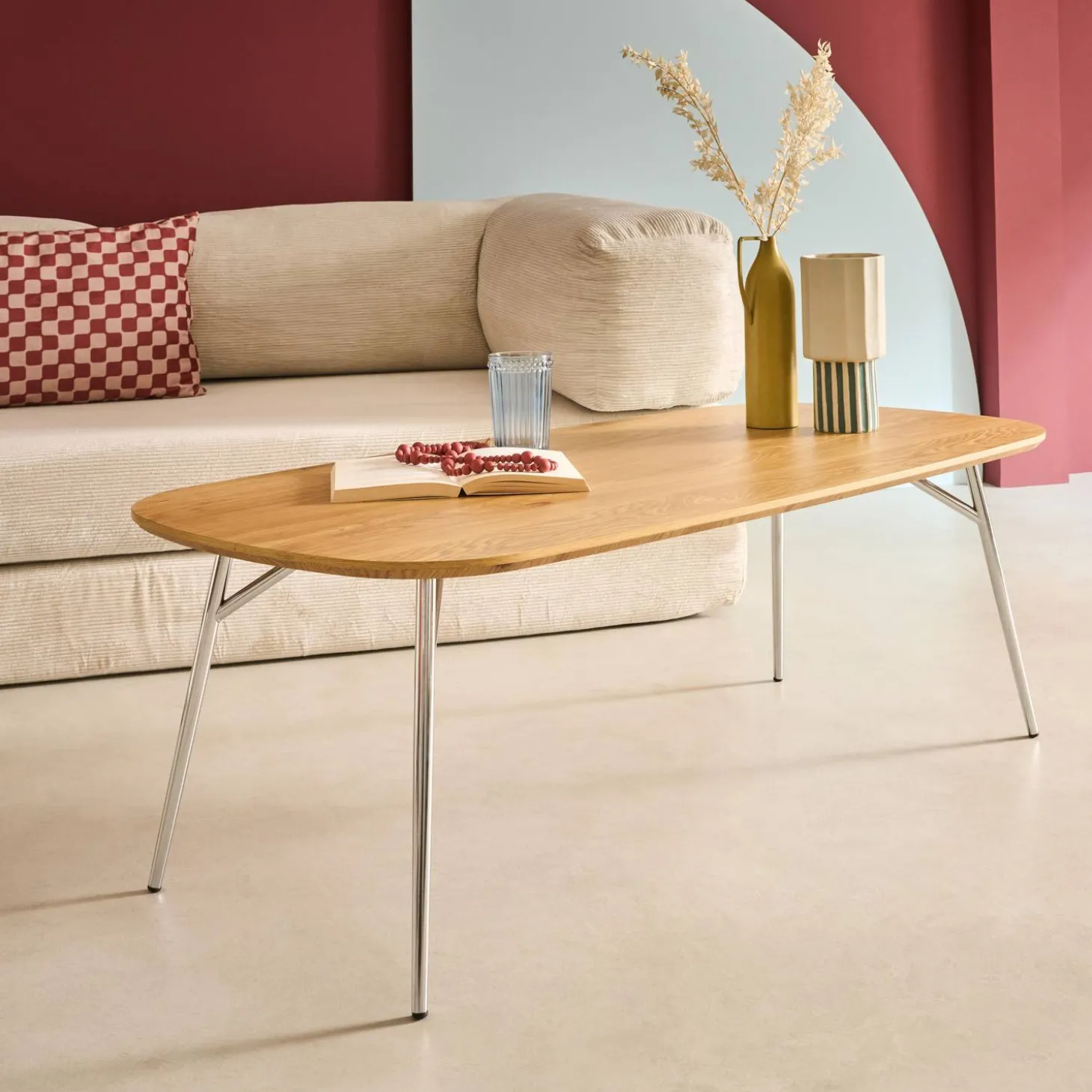 Rectangular coffee table with chrome legs and wood decor