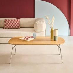 Rectangular coffee table with chrome legs and wood decor