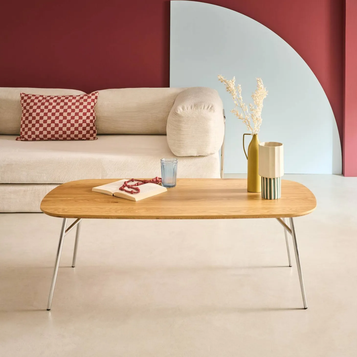Rectangular coffee table with chrome legs and wood decor