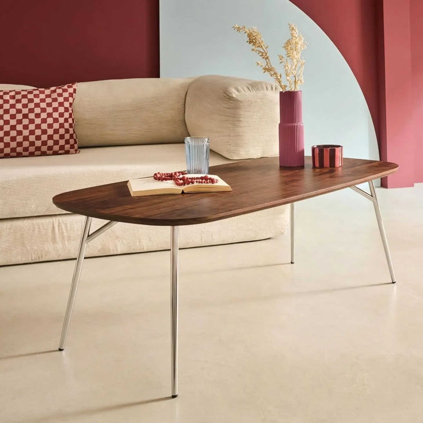 Rectangular coffee table with chrome legs and wood decor