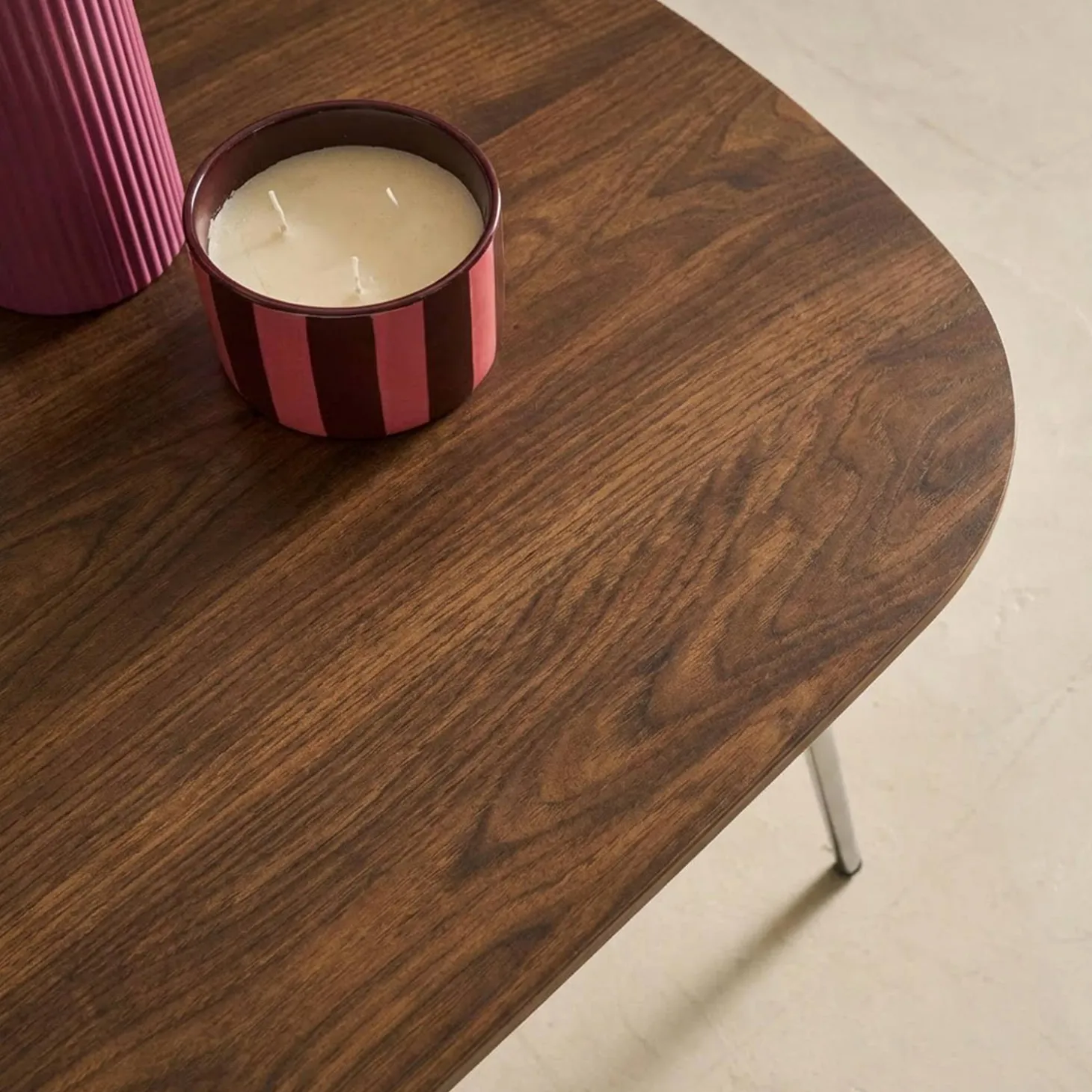 Rectangular coffee table with chrome legs and wood decor