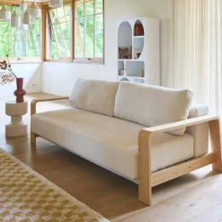 3-seater sofa bed in white boucle with wooden armrests