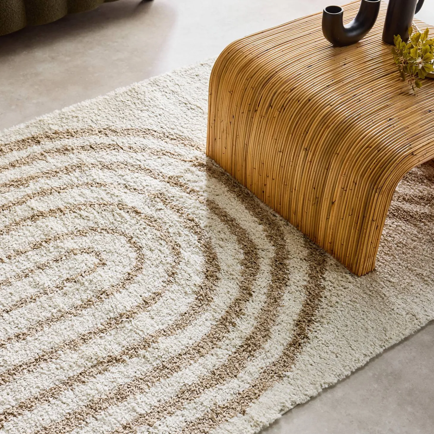 Shaggy indoor rug, rainbow geometric patterns, beige.