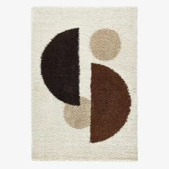 Shaggy indoor rug with circular patterns in beige, brown, black