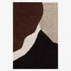 Shaggy indoor rug with geometric patterns in beige, brown and black