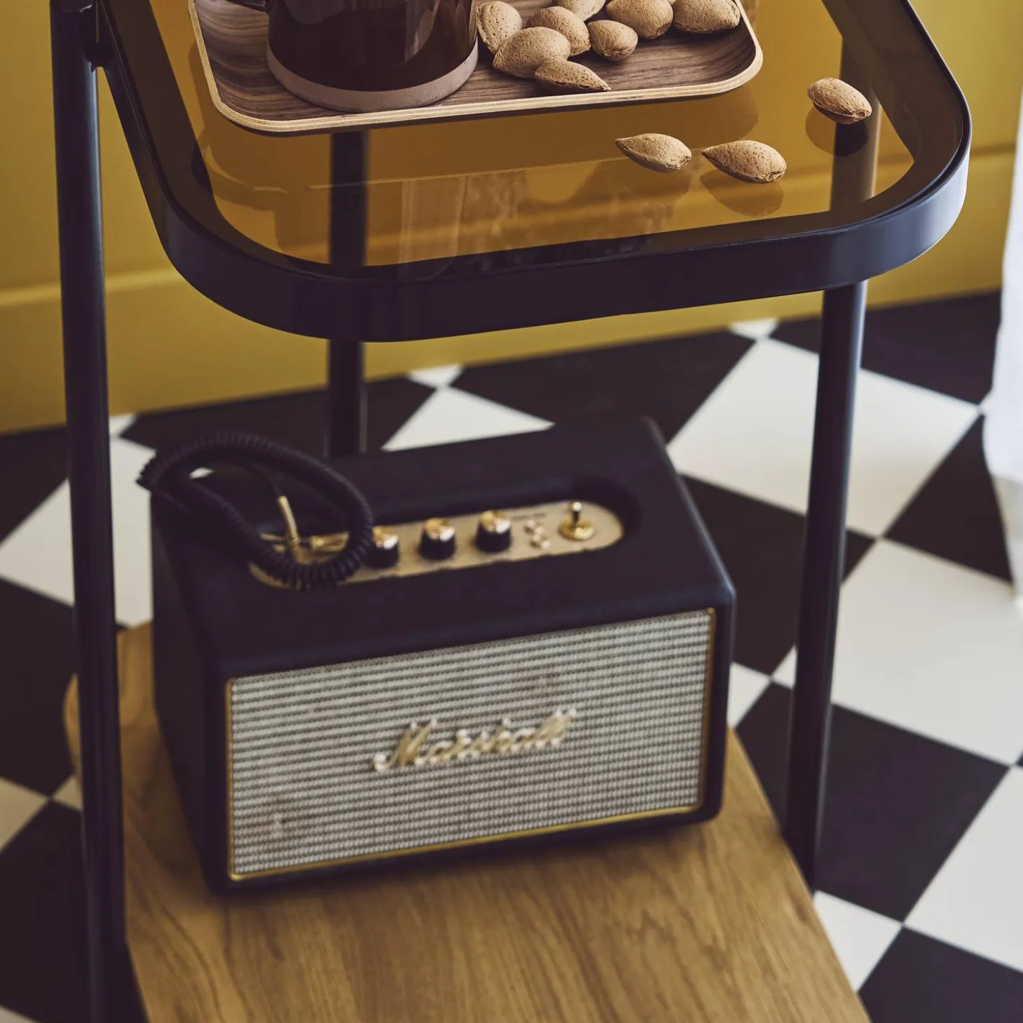 Vintage black metal side tables with glass tops