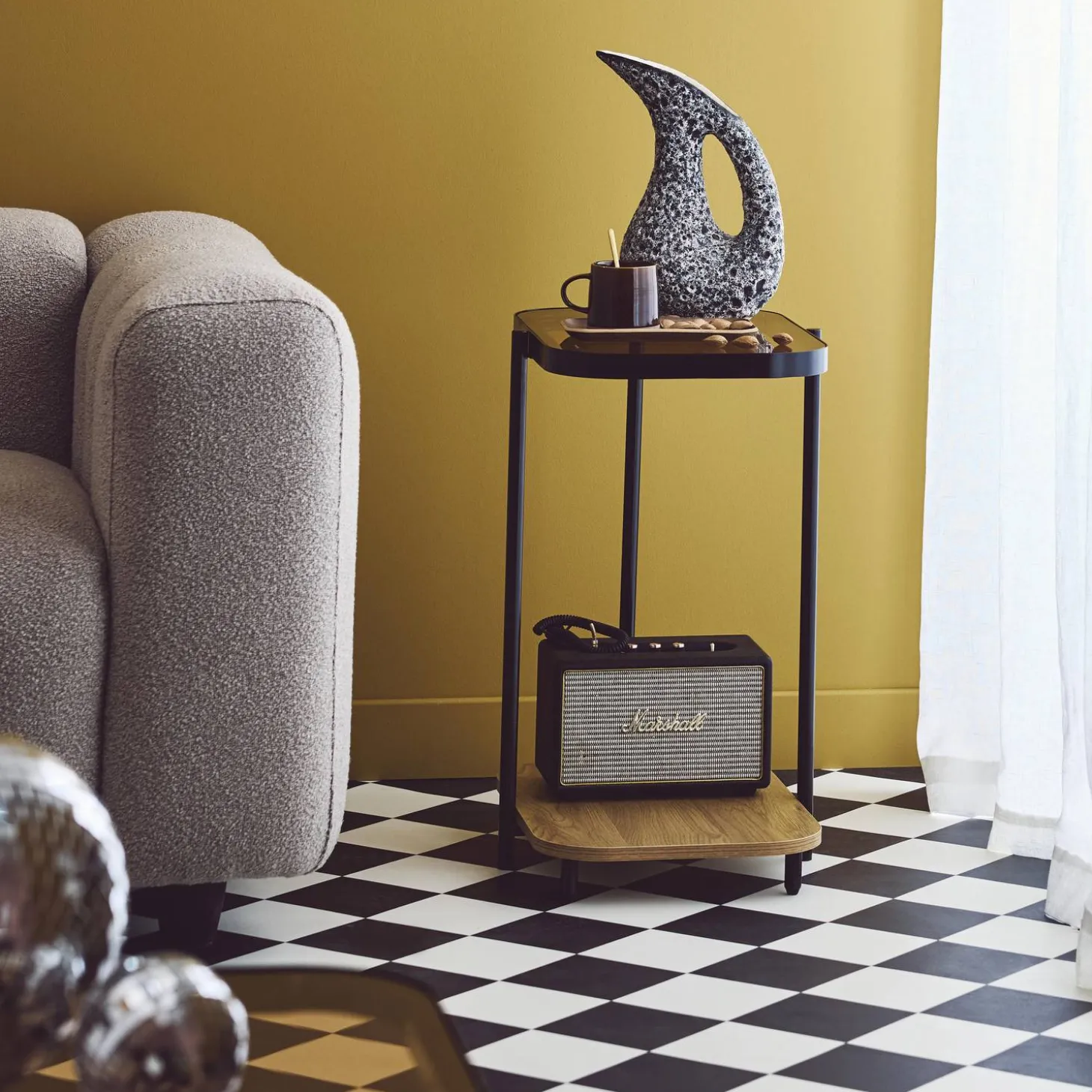 Vintage black metal side tables with glass tops