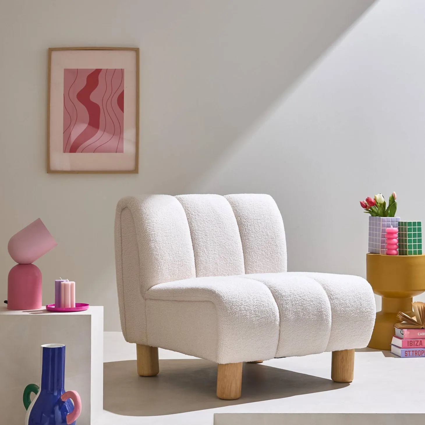 Wooden armchair with rounded legs in boucle fabric