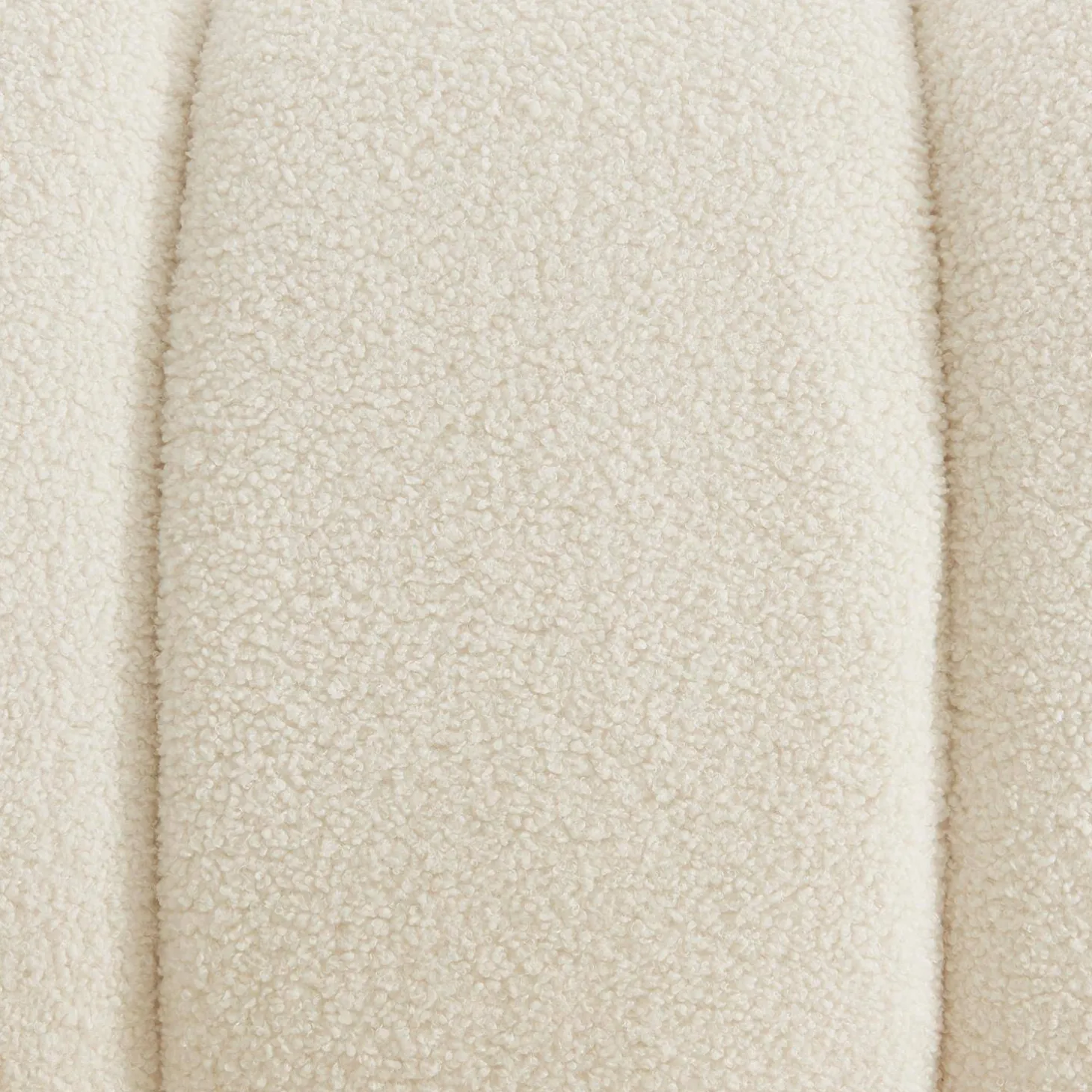 Wooden armchair with rounded legs in boucle fabric