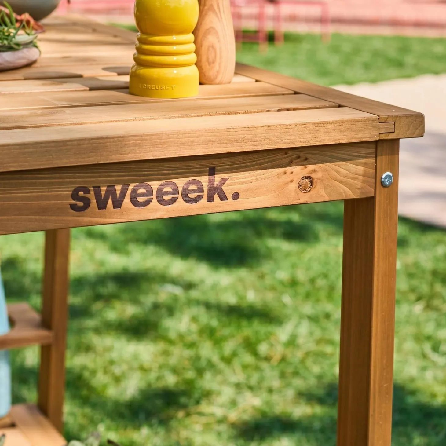 Wooden barbecue sideboard with wheels and a handle