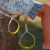Wooden trapeze with metal rings