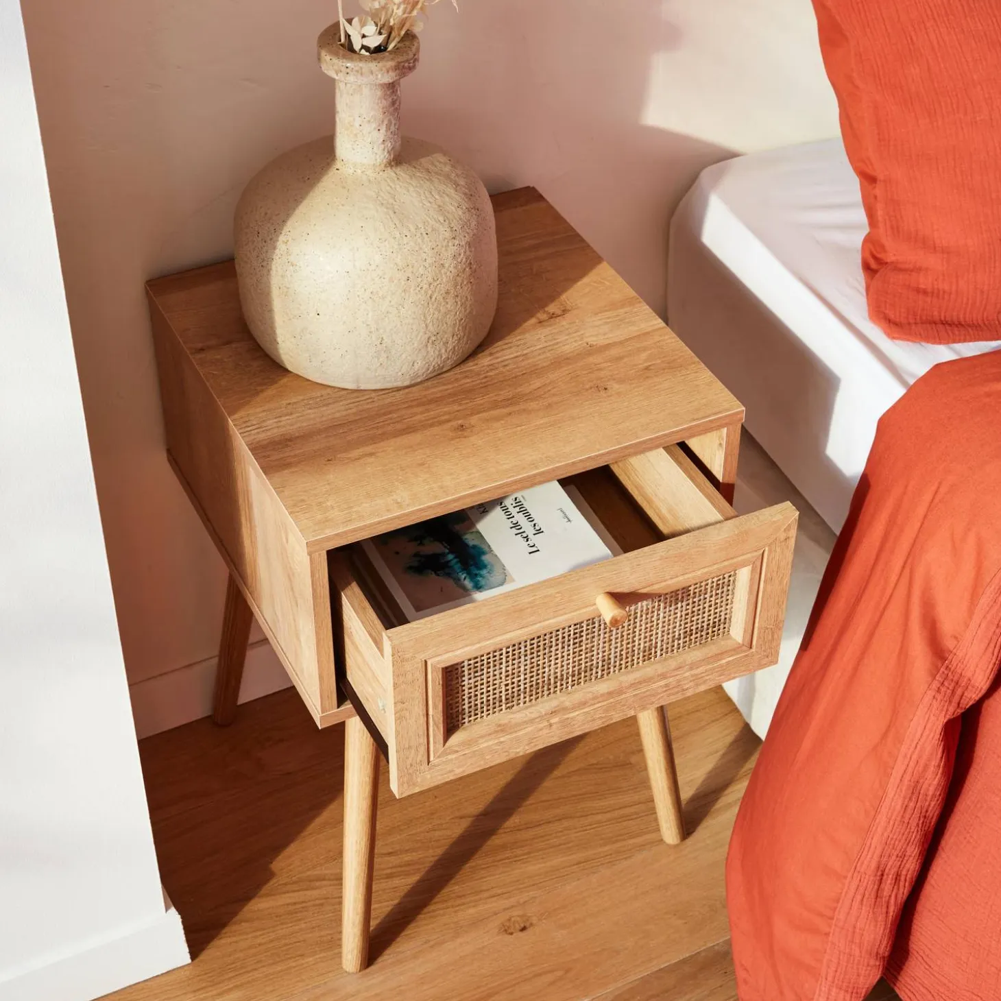 Woven rattan bedside table with drawer