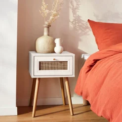 Woven rattan bedside table with drawer
