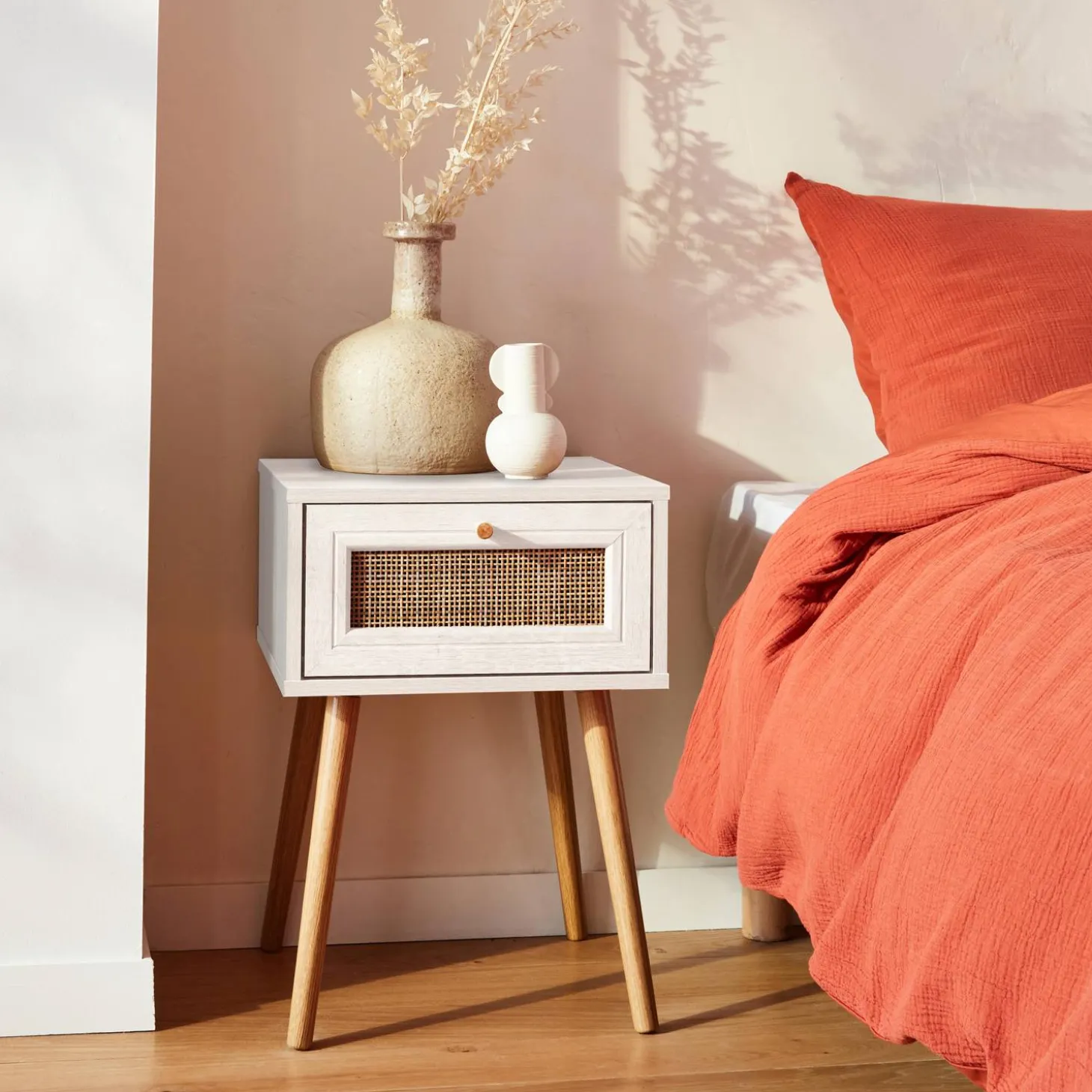 Woven rattan bedside table with drawer